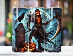 three halloween themed mugs sitting on top of a white table next to each other