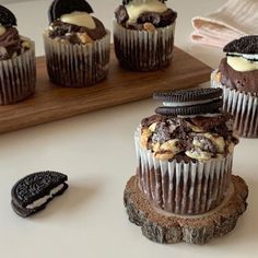 chocolate cupcakes with oreo cookies and cream filling on top, ready to be eaten