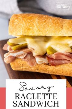 a sandwich with ham, cheese and pickles on it