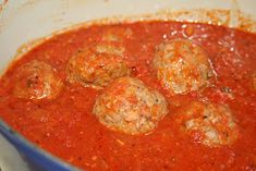 meatballs and tomato sauce in a blue pot