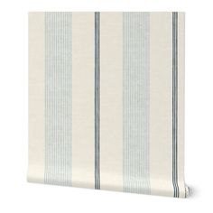 a white and blue striped wallpaper with vertical stripes on the bottom half of it