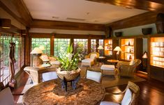 a living room filled with furniture and lots of windows