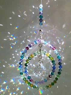 the sun catcher is made with multicolored beads