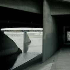 an underpass with water running underneath it