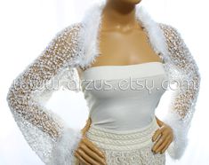 a mannequin wearing a white dress and jacket