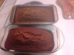 three pans filled with brownies sitting on top of a counter next to each other