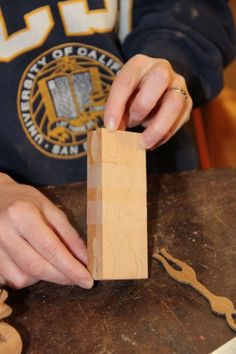 a person is working with woodworking on a table