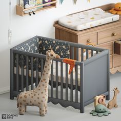 a toy giraffe standing next to a baby crib