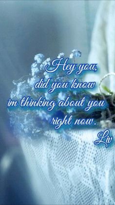 a bouquet of flowers sitting on top of a lace covered table cloth with the words, hey you, did you know i am thinking about you right now?