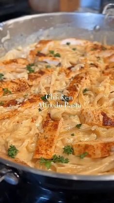 chicken alfredo pasta in a pan on the stove