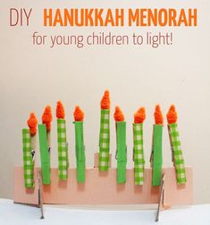 a group of toothbrushes sitting on top of a wooden board with green and orange strips