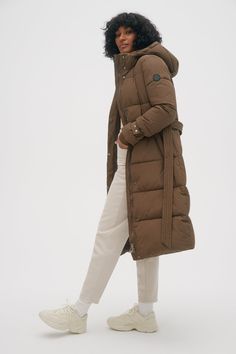 Filled with insulating material, the quilted Mara parka will shield you from the cold. It is equipped with a detachable hood and a belt at the waist. Its storm placket on the front gives it a sleek and elegant feel. Long Hooded Jacket, Jacket Parka, Womens Parka, Plus Size Shopping, Leather Vest, Warm Coat, Detachable Hood, Hoodies For Sale, Puffer Coat