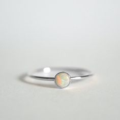 Natural Opal Ring, 925 Sterling Silver, Round Opal Gemstone Ring, Natural Gemstone, Simple Band Ring, Christmas Gift, Can Be Personalized Ring Metal :- 925 Sterling Silver (Stamp on the Product) **Gemstone Size depends on the Ring Size.** **The Product you will receive may vary from the image as no two gemstone are similar and images cannot define exact product definitions.** Shipping Policy:- I mainly use DHLE, PPS, FedEx for the shipping of goods depending on the amount and days that you have Silver Minimalist Opal Rings, Minimalist White Gold Opal Ring In Sterling Silver, Silver Opal Stackable Rings As Gift, Silver Sterling Silver Opal Ring, Sterling Silver Opal Ring Gift, Sterling Silver Opal Ring With Bezel Setting, Sterling Silver Opal Ring With Bezel Setting As Gift, Stackable White Gold Opal Ring As Gift, Gift Opal Ring With Bezel Setting In Sterling Silver