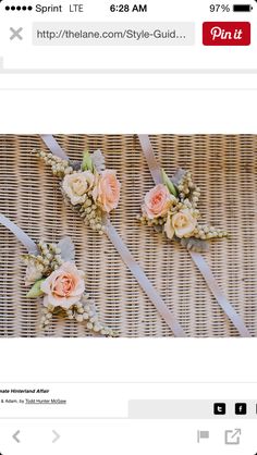 two boutonnieres with flowers on them sitting on a wicker tablecloth