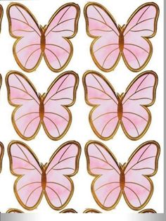 pink butterflies are arranged in the shape of cookies on a white background with gold trim