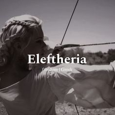 a woman holding a bow and arrow with the words eleftheria on it