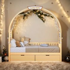 a bed that has some lights on the headboard and foot board in front of it