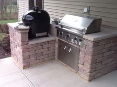 an outdoor bbq and grill on a patio