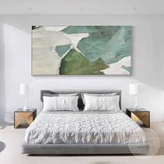 a bedroom with a large painting on the wall above the bed and two nightstands