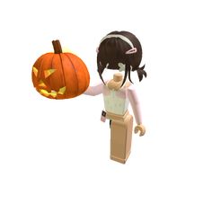 a girl holding a pumpkin in her hand