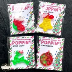 three different colored plastic christmas ornaments in front of a black background with the words poppin'on it