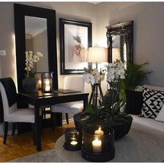 a living room filled with furniture and a mirror