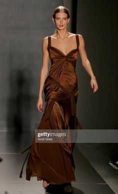 For Sale on 1stDibs - TheRealList presents: a stunning copper brown silk satin evening gown designed by Donna Karan for her Fall/Winter 2005 collection. A version of this piece Satin Dress Aesthetic, Brown Satin Dress, Brown Dresses Formal, Brown Silk Dress, Jungle Dress, Copper Dress, Satin Evening Gown, Oscar Dresses, Copper Brown