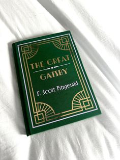 This handmade special edition of The Great Gatsby features emerald, gold, and lilac accents. The Great Gatsby Aesthetic, The Great Gatsby Book Cover, Sam Pauly, The Great Gatsby Book, Gatsby Book, Jordan Baker, Book Handmade, The Great, The Great Gatsby