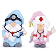 two small figurines are dressed as doctor and nurse