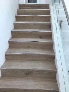 a set of wooden stairs leading up to a door