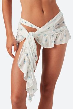 Introducing the Selena Sarong, crafted from our luxurious custom fabric. This perfect mini skirt features a chic front wrap tie closure and delicate ruffle details. Fun and frilly, Selena provides the perfect amount of coverage. Adjustable wrap style skirt Unlined, semi-sheer Ruffles along hemline Care tips can be found here. Blue Sarong, Blue Swimwear, White Swimwear, Pink Swimwear, Beachwear Collection, White One Piece, Wrap Mini Skirt, Black Swimwear, Style Skirt