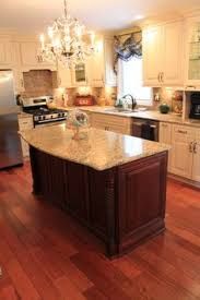 a large kitchen with an island in the middle