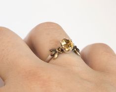 *This item is MADE TO ORDER- please allow one to two weeks for me to make your custom bee ring.* SIZE: 5 x 7mm natural faceted oval citrine stone in a solitaire prong setting (first option), OR, 4mm round rose cut bezel (second option). Requests for all other gemstones are welcome! Other stock options here: https://etsy.me/2AqhUrt PRODUCT INFO AND PROCESS: I create the sterling silver ring band and mount for each of these using traditional silversmithing techniques, then solder on the tiny brass Citrine Engagement Ring, Citrine Ring Engagement, Silver Ring Band, Bee Ring, Alternative Engagement Ring, Second Option, Stock Options, Sterling Silver Rings Bands, Citrine Stone