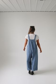 Frankie Denim Overalls are crafted from washed denim for a stylish, weathered look. Featuring an oversized and loose fit with adjustable straps and distressed details, these overalls are designed to provide a comfortable, personalized fit. Model Measurements: Hips 34” Waist 25” Bust 32” Height 5’6.5, wearing a size small Material: 100 Cotton Measurements XS: Hips: 42"| Length: 44" (taken from top of front of overalls to ankle cuff) S: Hips: 42"| Length: 44.5" (taken from top of front of overalls to ankle cuff) M: Hips: 46" | Length: 45" (taken from top of front of overalls to ankle cuff) L: Hips: 48" | Length: 45.5" (taken from top of front of overalls to ankle cuff) Bridesmaid Tops, Nursing Friendly, Ankle Cuffs, Washed Denim, Denim Overalls, Man Swimming, Romper Pants, Jean Skirt, Trending Dresses