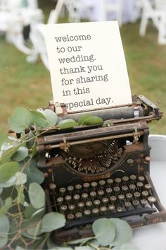 an old fashioned typewriter with a note attached to it