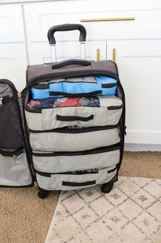 two suitcases are stacked on top of each other in front of a facebook page