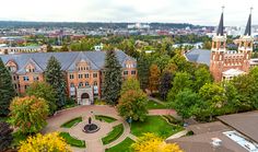 an aerial view of a campus with trees and buildings in the background