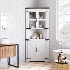 a bathroom with white tile and wooden cabinets in the corner next to a bathtub