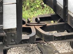 an image of the back end of a train car that is rusted and broken