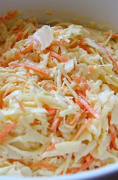 shredded carrots and cabbage in a white bowl