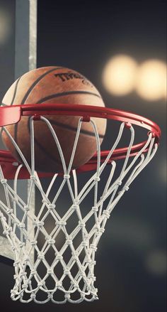 a basketball going through the hoop with it's net