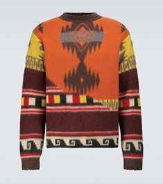 an orange sweater with multicolored patterns on the front and back, is shown