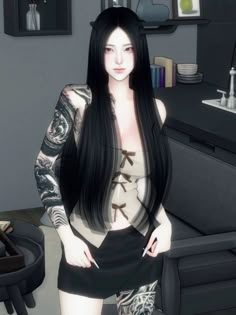 a woman with long black hair and tattoos standing in front of a couch next to a table