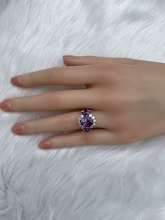 The key stone of this ring is a 11x9mm natural amethysts, and the main material of this ring is sterling silver plated with 18k white gold. On each side of the main stone are one 5x3mm and two 5x2.5mm amethysts. The small accent stones and zircon emphasize the big size of the key stone. Amethyst is a birthstone for February, and the color purple is meant to bring wealth and royalty. Also, many people believe amethyst has the power to relieve stress and purify the mind. Size: Adjustable and fitab Fine Jewelry Pear-shaped Crystal Ring For Anniversary, Exquisite Amethyst Ring With Accent Stones, Anniversary Cubic Zirconia Crystal Ring With Gemstone, Elegant Amethyst Open Ring For Wedding, Anniversary Ruby Ring With Cubic Zirconia, Emerald Cut Birthstone Ring With Accent Stones, Elegant Open Amethyst Ring For Wedding, Promise Amethyst Ring, Fine Jewelry Cluster Ring With Gemstone