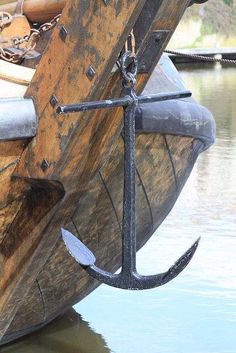 an anchor is attached to the side of a boat