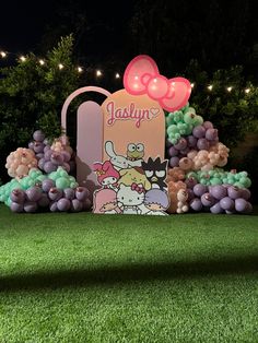 an outdoor display with balloons in the shape of cartoon characters