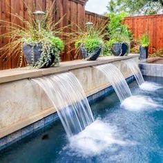 a water feature in the middle of a pool