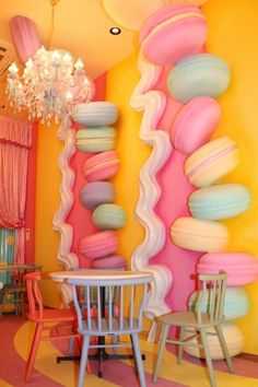 a room with colorful walls and chairs in it