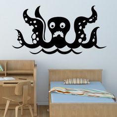 an octopus wall decal in a child's room with a bed and desk