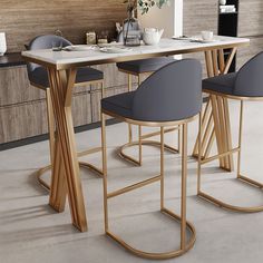 a dining table with four chairs and a vase on the counter top in front of it